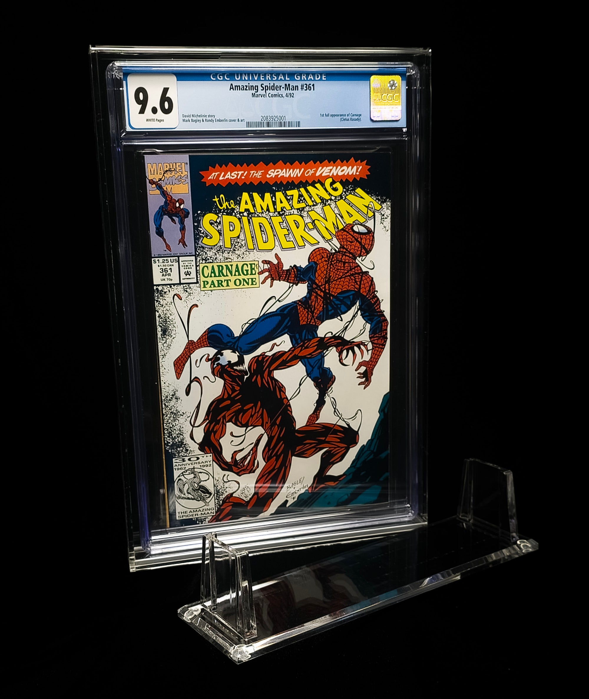 Comic book 'The Amazing Spider-Man' in a clear holder with a CGC label on a black background